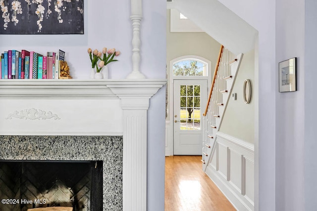 interior space featuring hardwood / wood-style floors and decorative columns