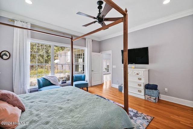 bedroom with ceiling fan, light wood-type flooring, and ornamental molding