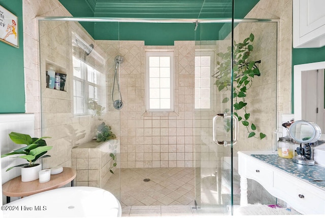 bathroom featuring vanity and an enclosed shower