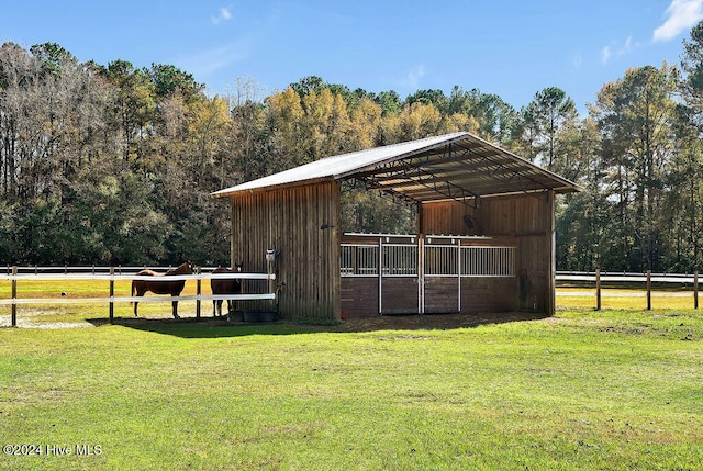 view of outbuilding with a rural view