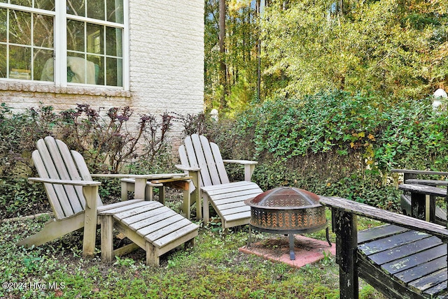 view of patio / terrace featuring an outdoor fire pit