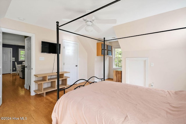 bedroom with light wood-type flooring and ceiling fan