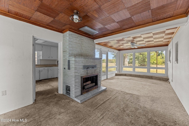 unfurnished living room with carpet, wood ceiling, ceiling fan, and a fireplace