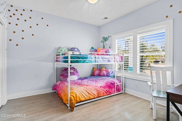 bedroom featuring hardwood / wood-style flooring and ceiling fan