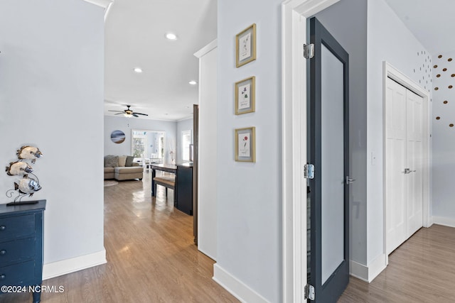 corridor featuring light hardwood / wood-style floors