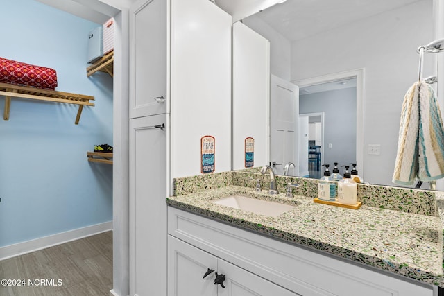 bathroom featuring vanity and wood-type flooring