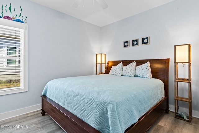 bedroom featuring hardwood / wood-style flooring and ceiling fan