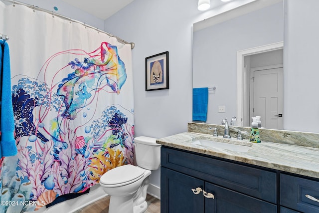 full bathroom featuring vanity, toilet, shower / tub combo, and hardwood / wood-style floors