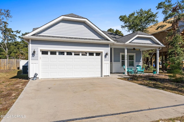 view of front of house with a garage and ceiling fan