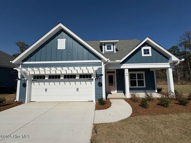 view of front of house featuring a porch and a garage