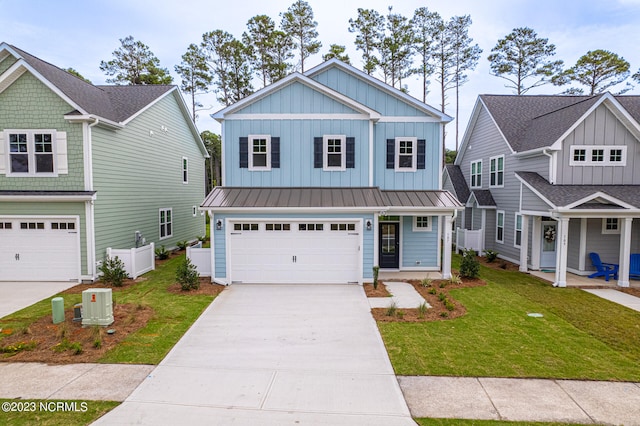 craftsman inspired home with a garage and a front lawn