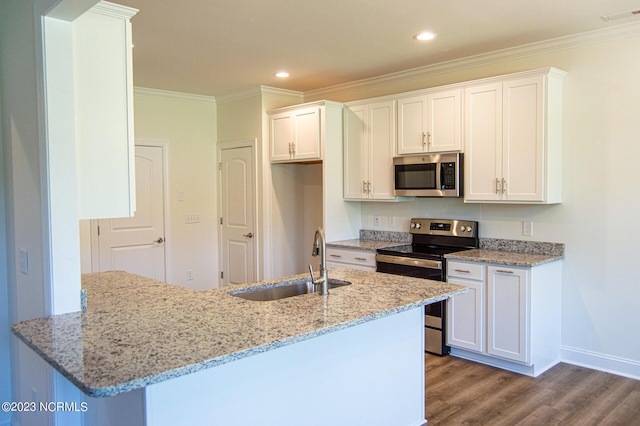 kitchen featuring white cabinetry, sink, light stone counters, and appliances with stainless steel finishes