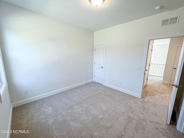 unfurnished bedroom featuring light colored carpet