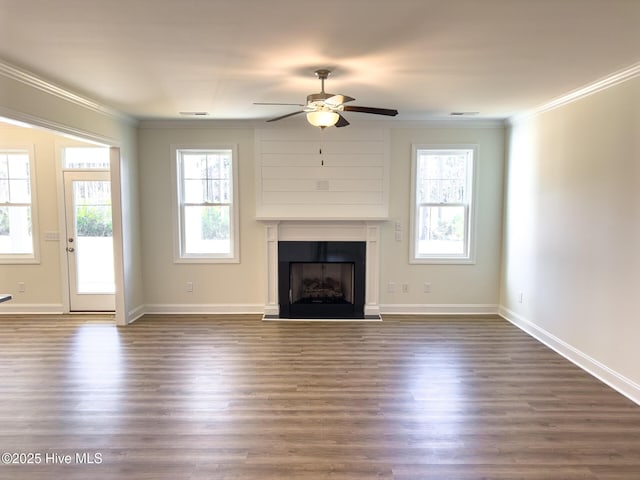 unfurnished living room with dark hardwood / wood-style flooring, ceiling fan, and crown molding