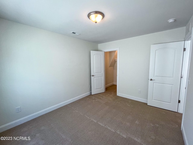 unfurnished bedroom featuring carpet flooring