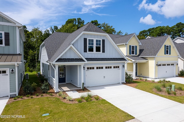 view of front facade featuring a garage and a front lawn