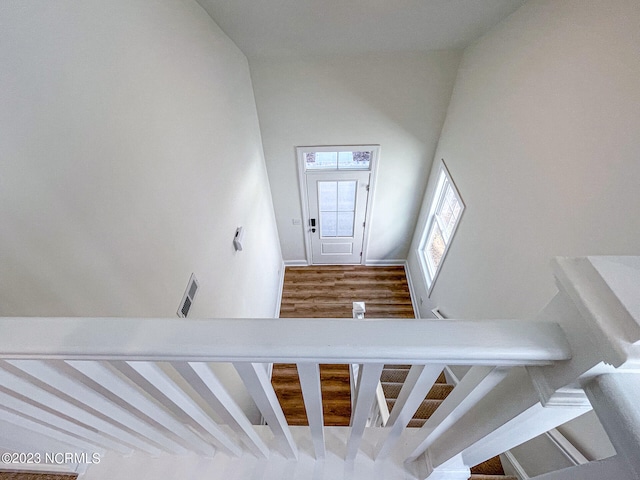 stairway featuring hardwood / wood-style floors