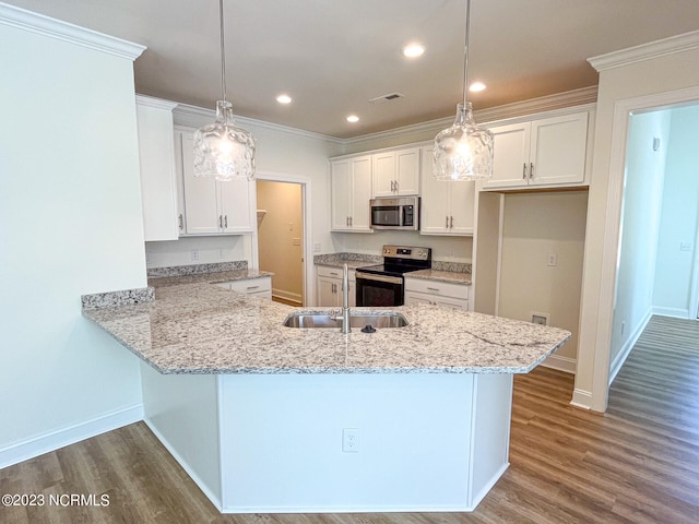 kitchen featuring appliances with stainless steel finishes, hanging light fixtures, white cabinetry, and kitchen peninsula