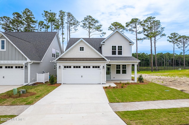 craftsman-style home featuring a front yard and covered porch