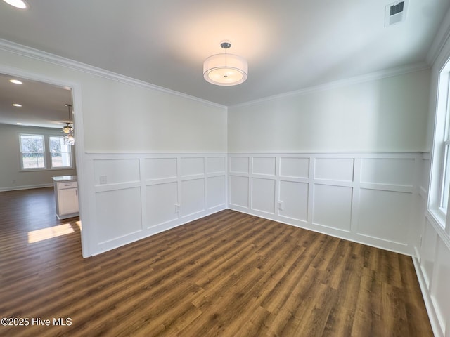 unfurnished room featuring ceiling fan, ornamental molding, and dark wood-type flooring