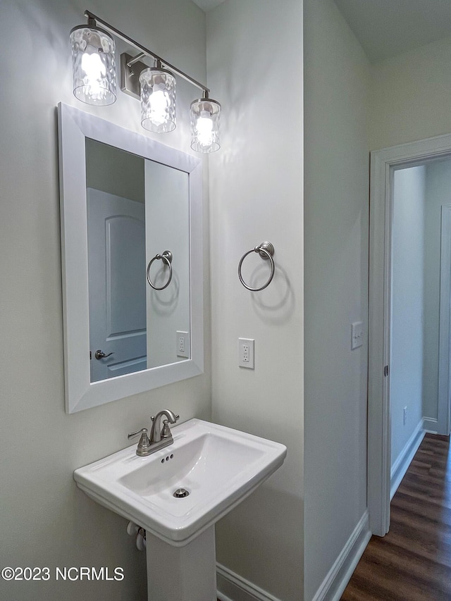 bathroom featuring sink and hardwood / wood-style flooring