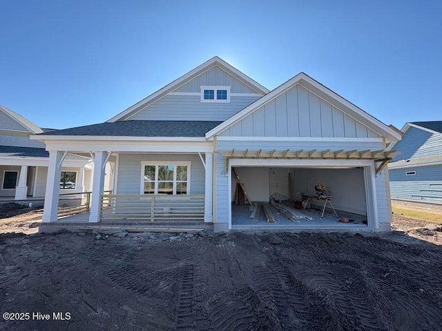 view of front of house featuring covered porch and a garage