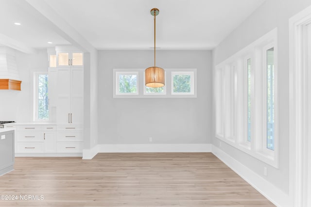 unfurnished dining area with light hardwood / wood-style flooring