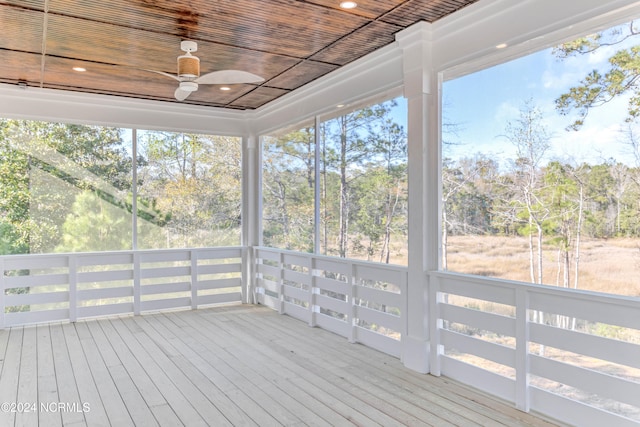 unfurnished sunroom with wood ceiling