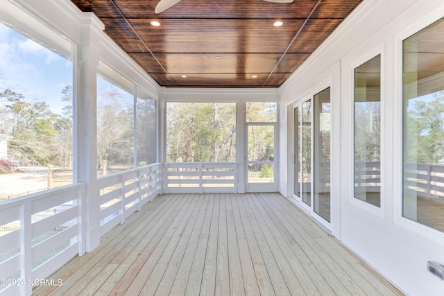 unfurnished sunroom featuring wooden ceiling