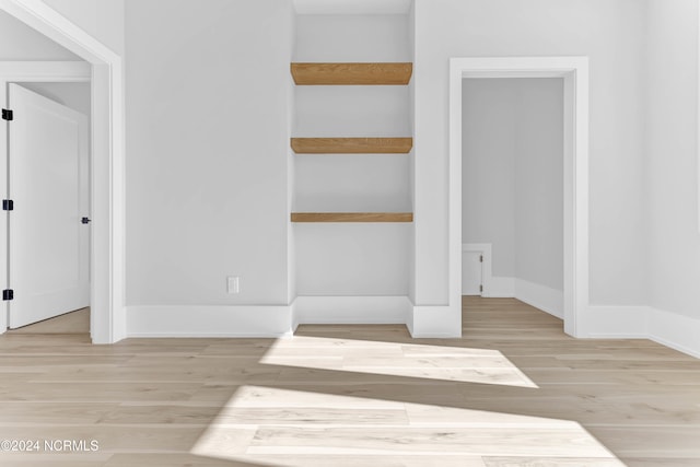 unfurnished bedroom with light wood-type flooring