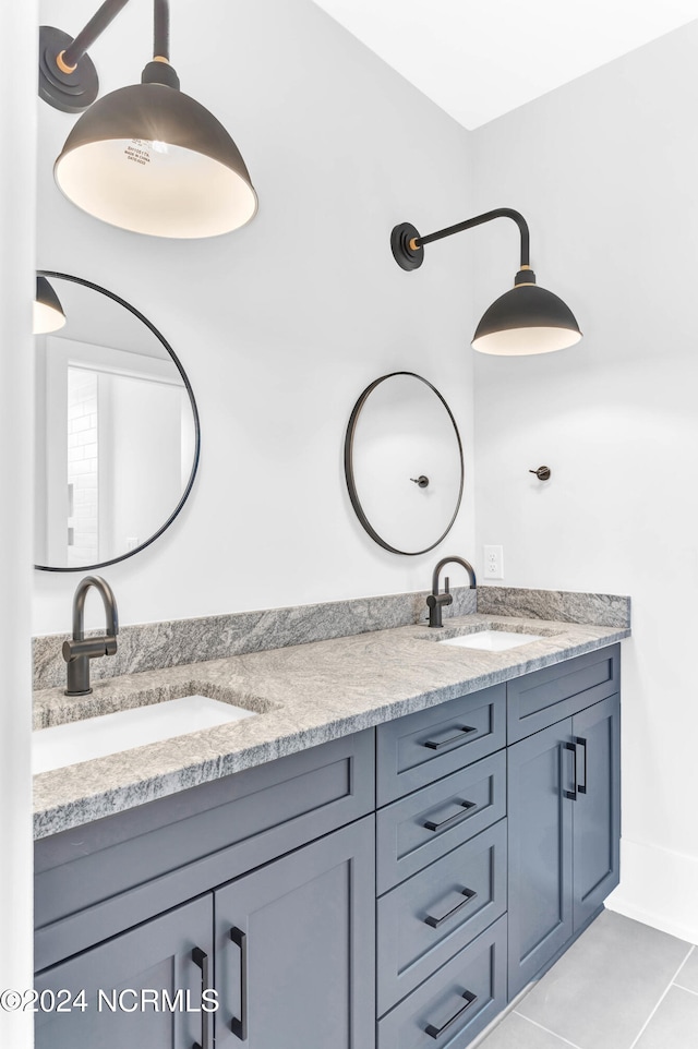 bathroom featuring vanity and tile patterned flooring