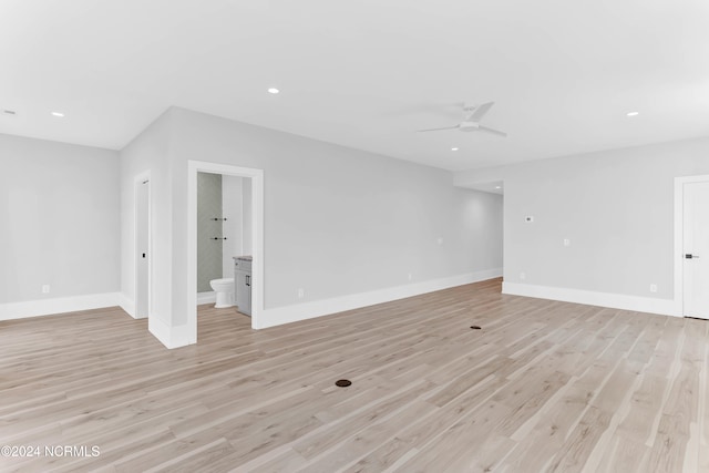 spare room with light hardwood / wood-style flooring and ceiling fan