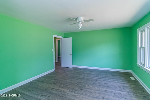 unfurnished room with ceiling fan, a healthy amount of sunlight, and hardwood / wood-style floors