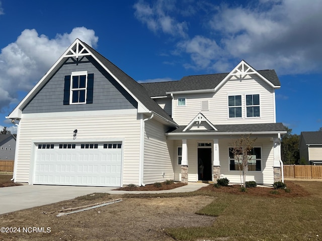 craftsman-style house featuring a garage and covered porch