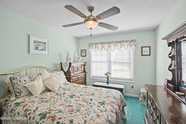 carpeted bedroom featuring a textured ceiling and ceiling fan