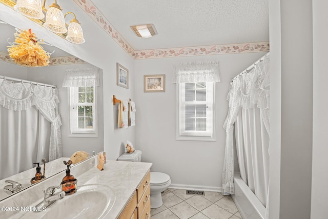 full bathroom featuring tile patterned floors, vanity, toilet, and a wealth of natural light