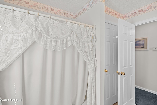 bathroom featuring a textured ceiling