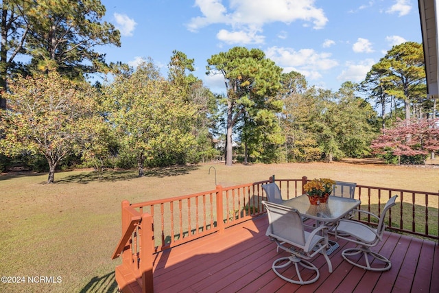 wooden deck with a yard