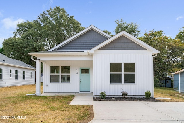 view of front of home with a front yard