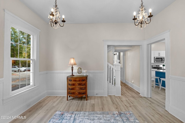 interior space featuring a chandelier and light wood-type flooring