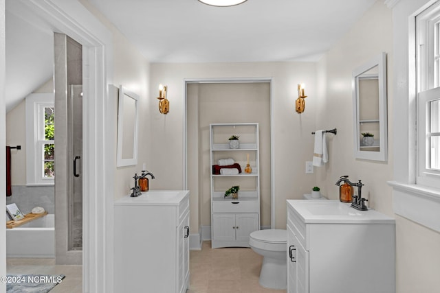 bathroom with vanity, toilet, and tile patterned floors