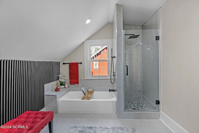 bathroom with lofted ceiling and independent shower and bath