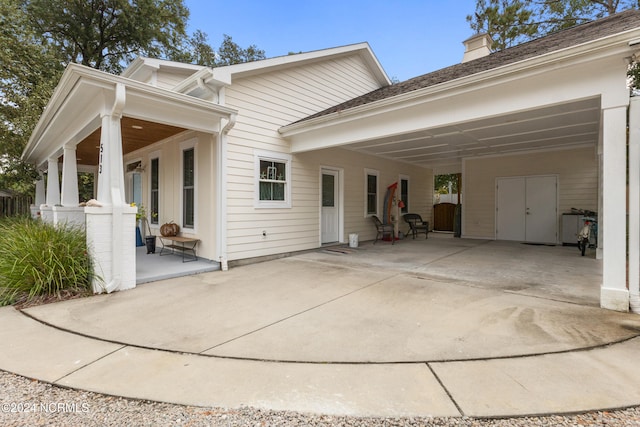 exterior space featuring a carport