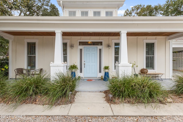 doorway to property featuring a porch