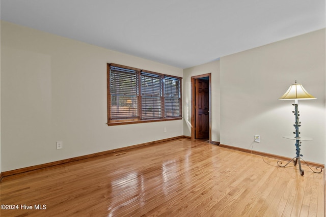 unfurnished room featuring light hardwood / wood-style floors