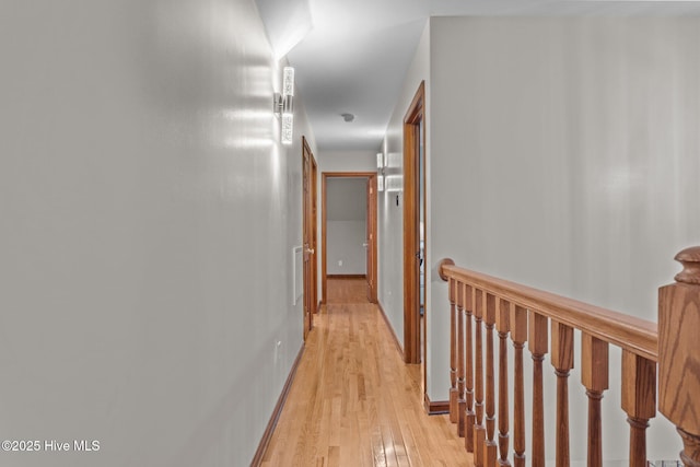 corridor with light wood-type flooring