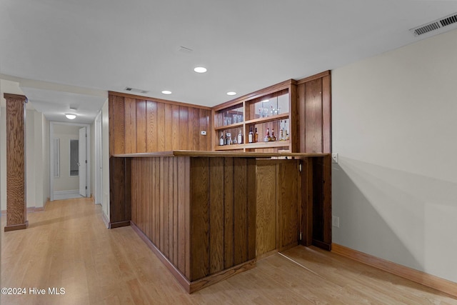 bar featuring light hardwood / wood-style floors