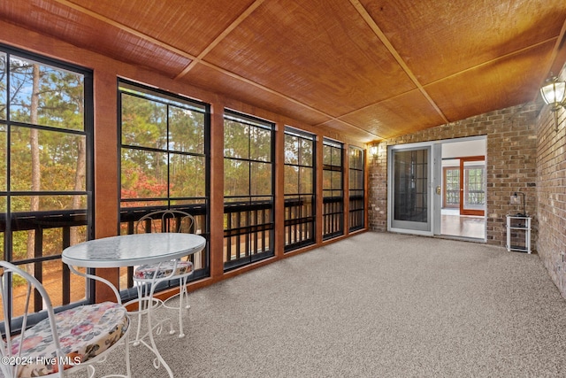 unfurnished sunroom featuring wooden ceiling