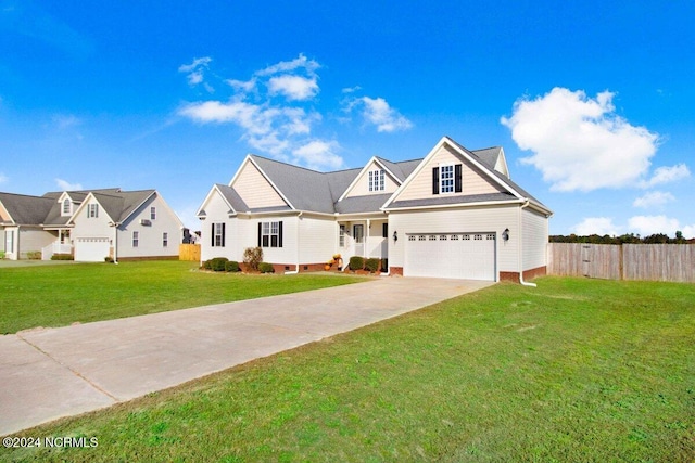 view of front of home featuring a front yard and a garage