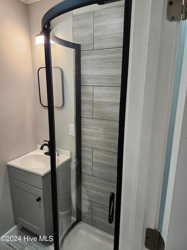 bathroom with vanity and an enclosed shower